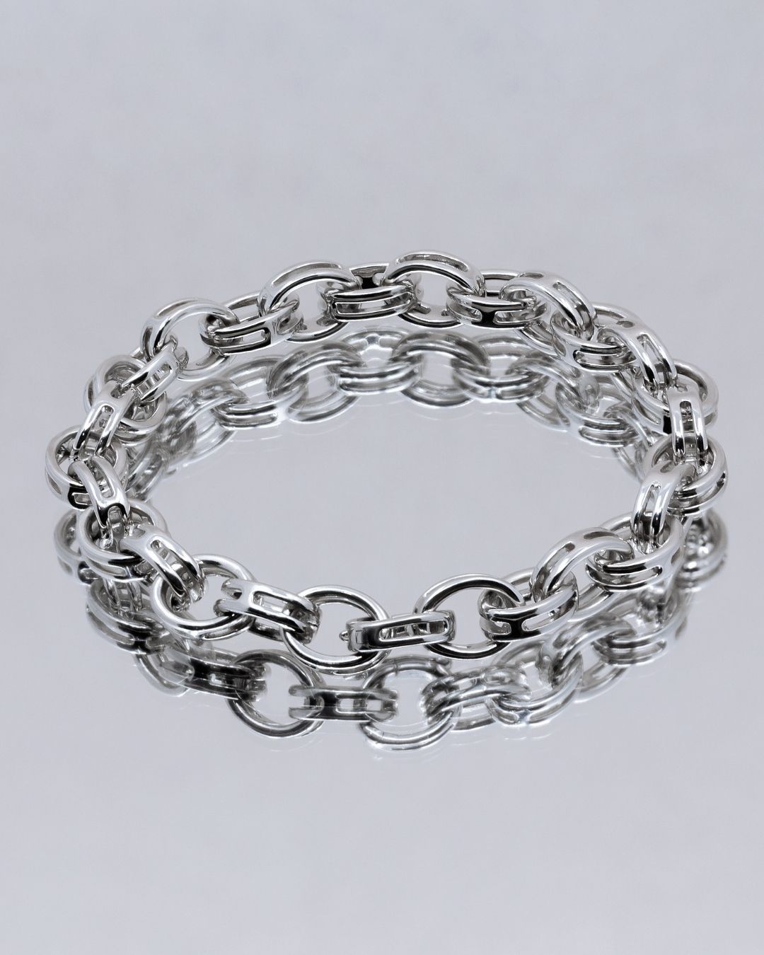 silver link bracelet on grey background