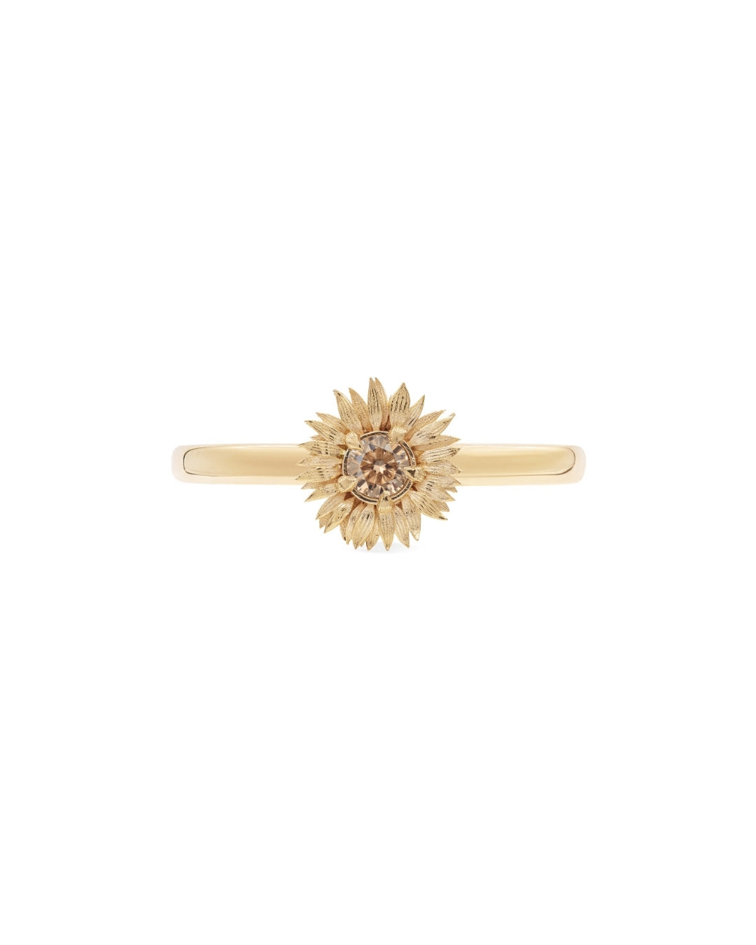 Gold ring with sunflower design on a white background