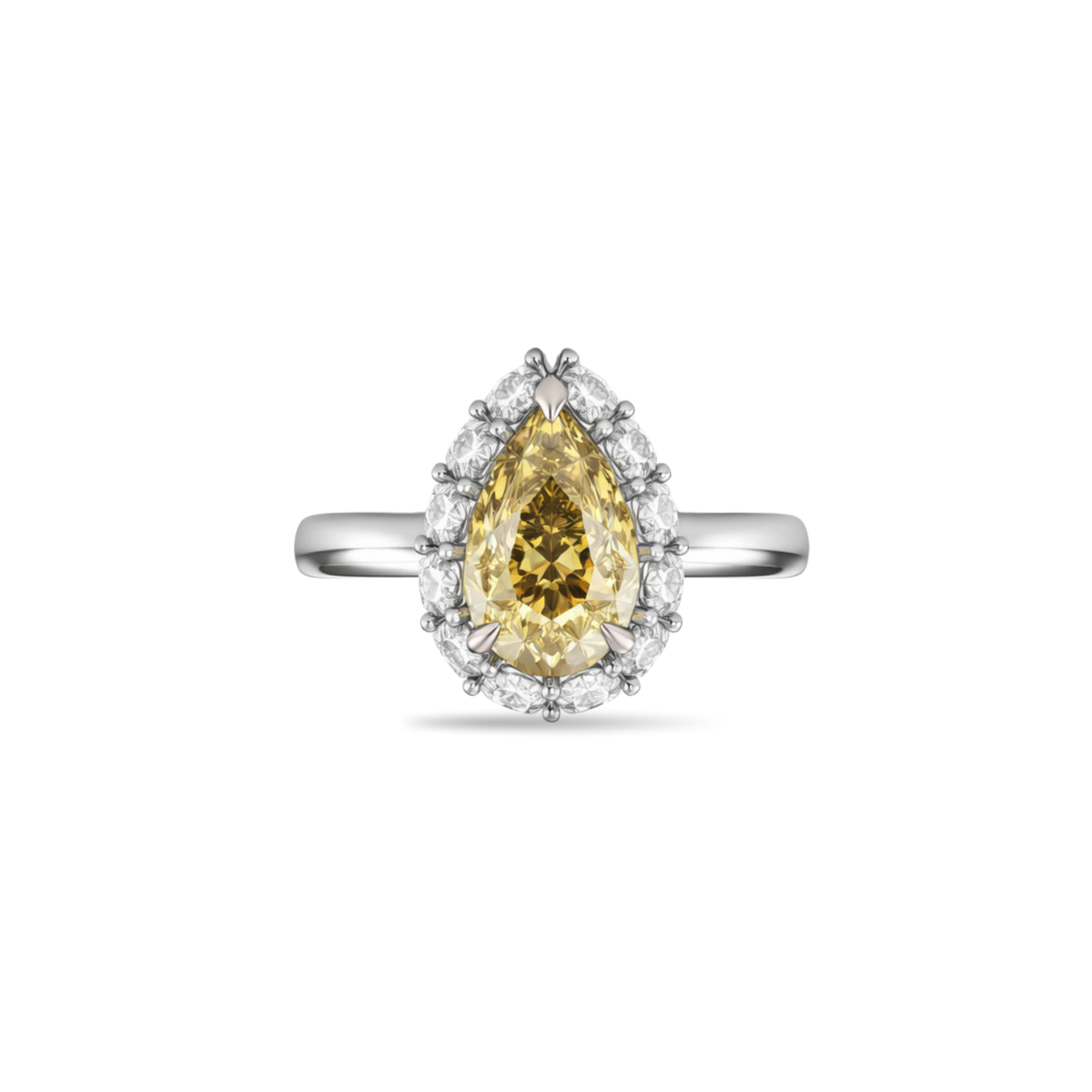 Ring with a pear-shaped yellow gemstone on a white background
