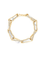 Gold bracelet with diamond accents on a white background