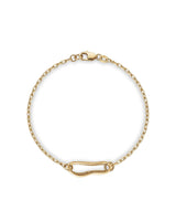 Gold bracelet with a safety pin design on a white background