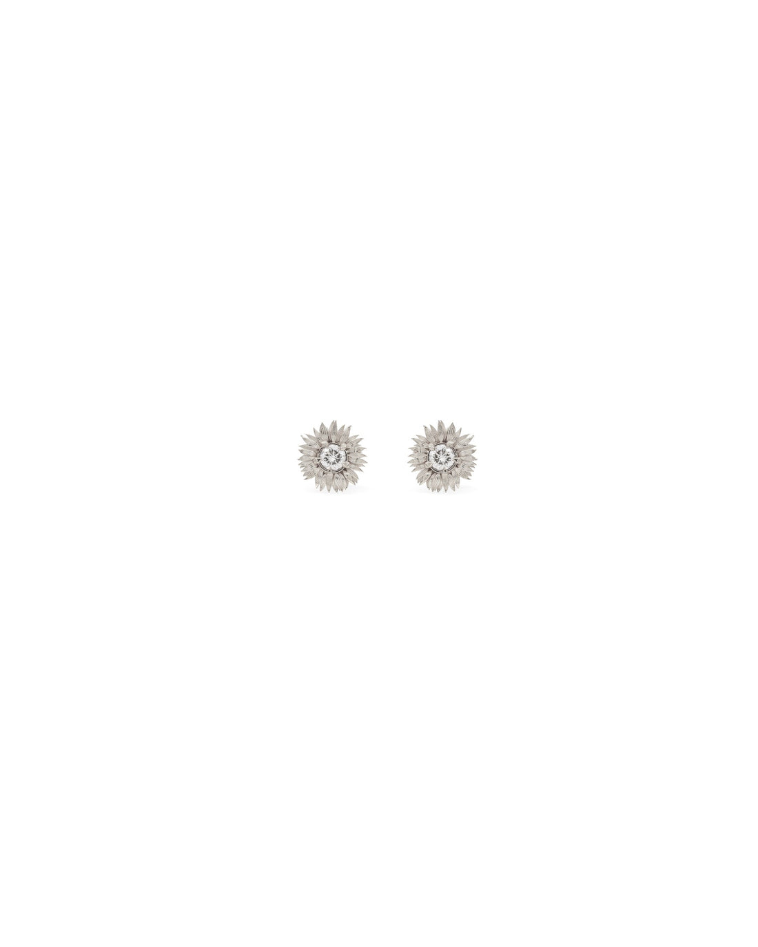 A pair of 14k white gold sunflower earrings with white diamonds at the center, presented against a white background.
