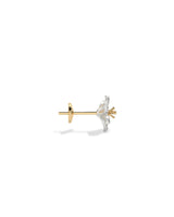 Gold and silver earring on a white background