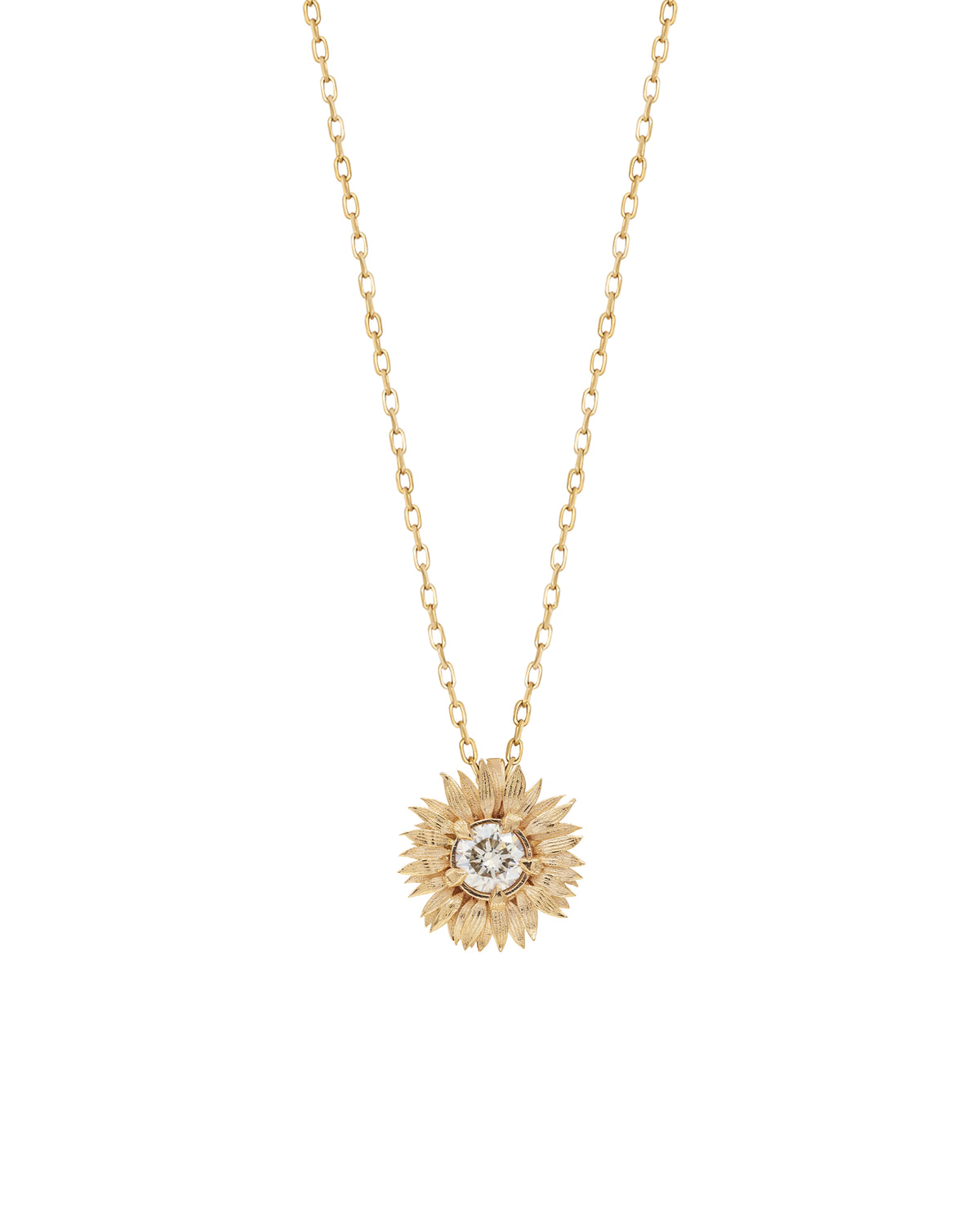 A yellow gold necklace with a sunflower charm pendant and a white diamond in its center on a white background.