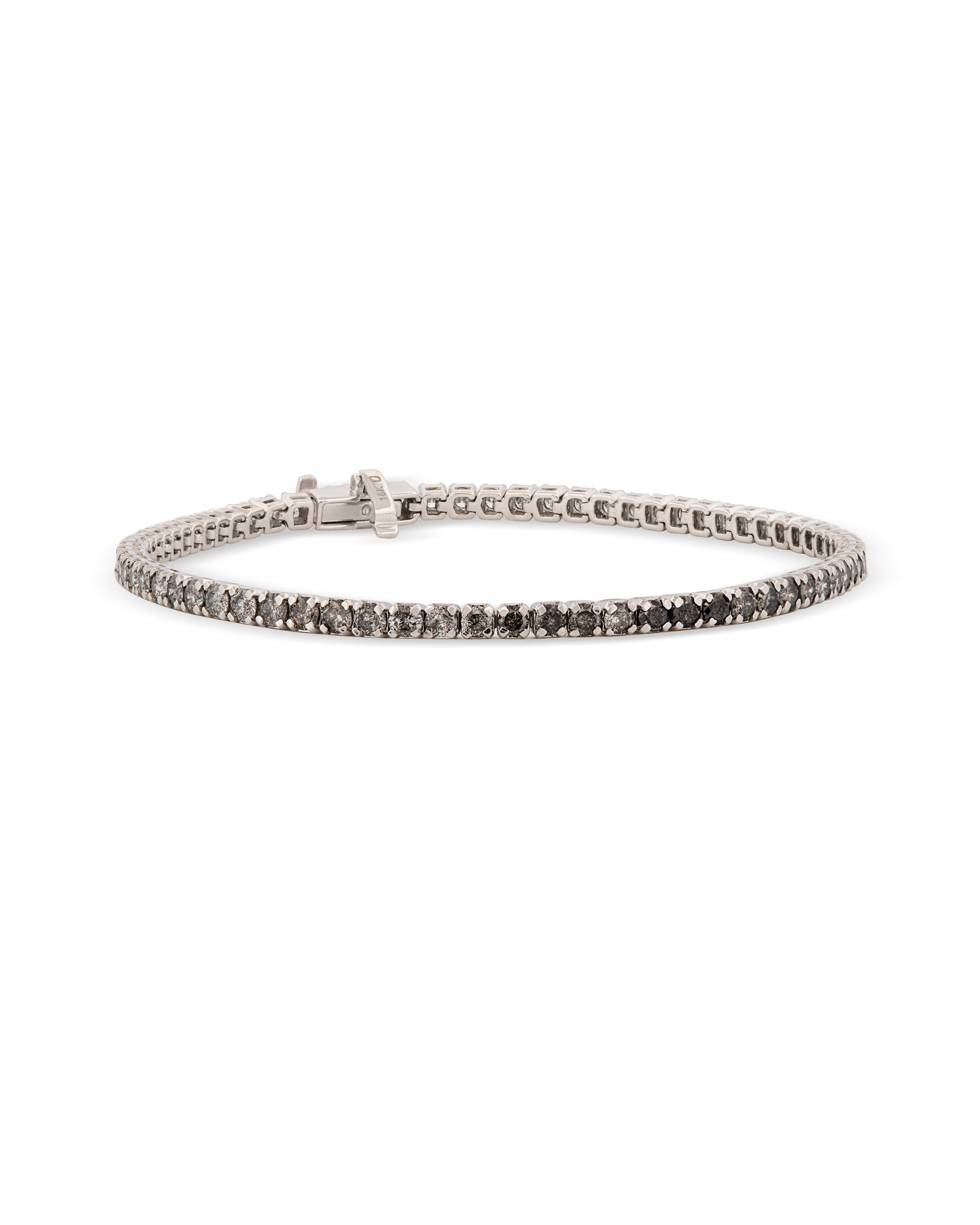 An 18k white gold tennis bracelet featuring a spectrum of diamonds in white, black, and salt & pepper colors.