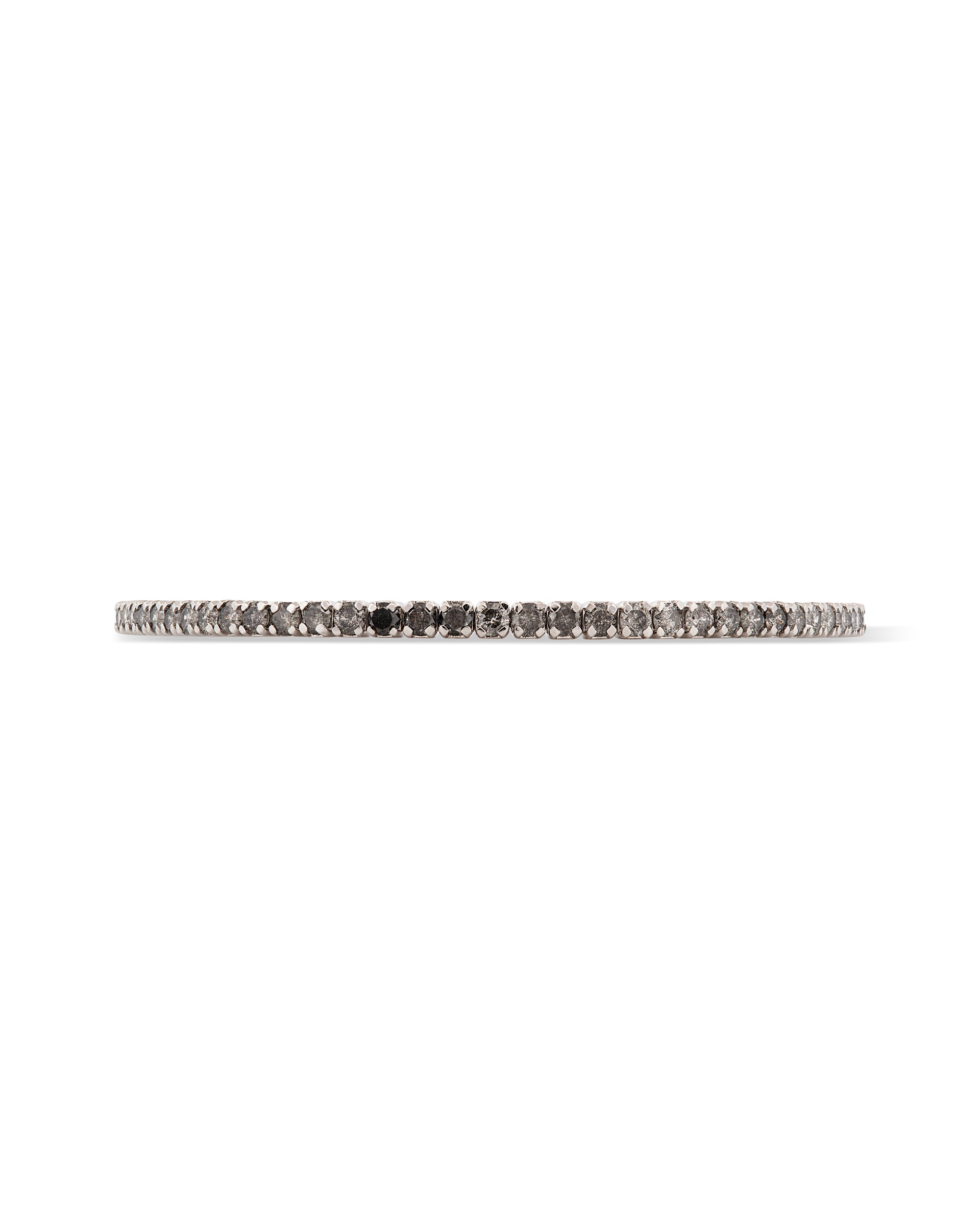 An 18k white gold tennis bracelet featuring a spectrum of diamonds in white, black, and salt & pepper colors.