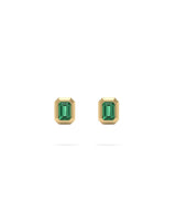 Pair of gold bezel rectangular  earrings with a green gemstone center on a white background