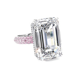 Diamond ring with pink diamonds on a white background