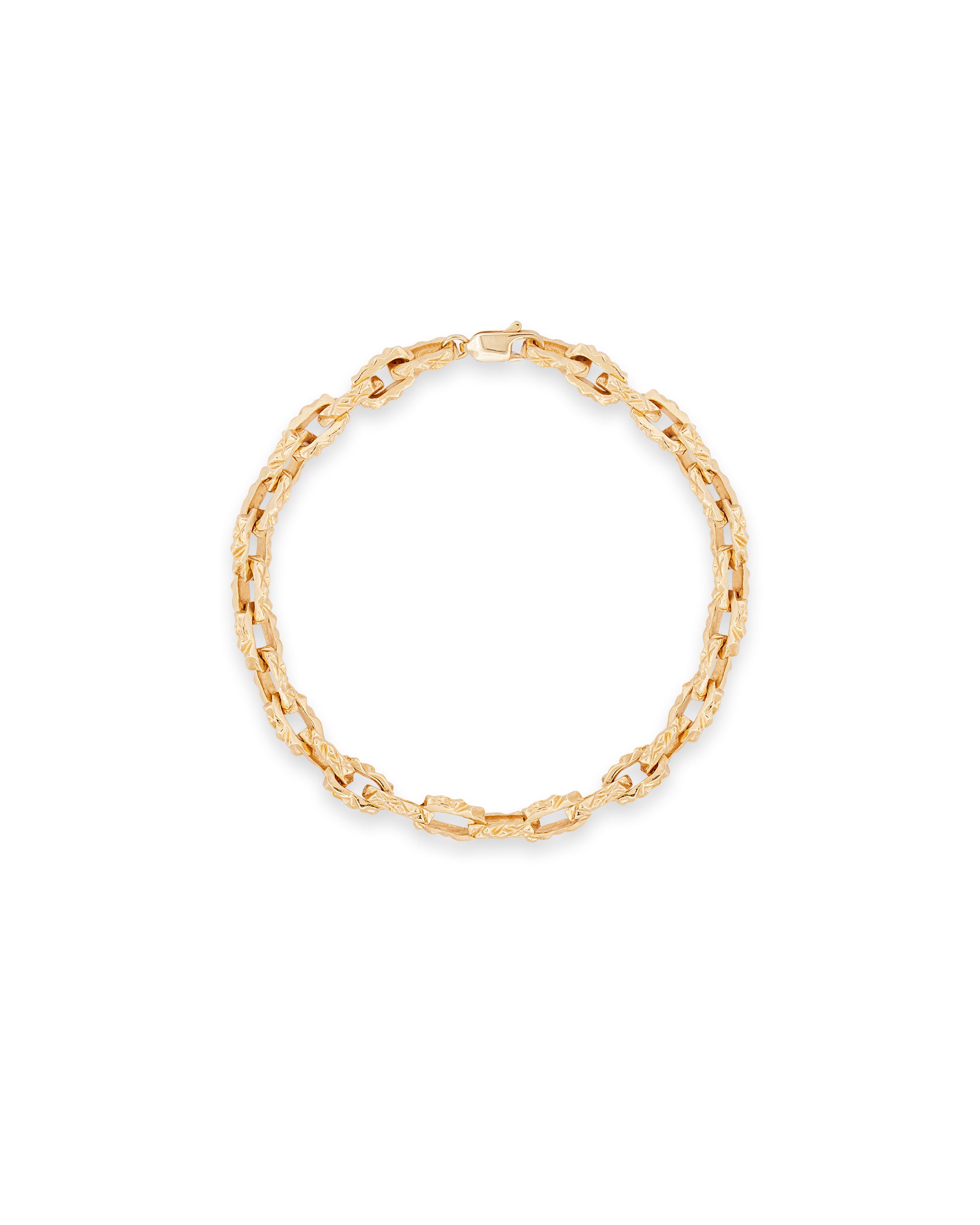 A gold-colored bracelet with a mirrored pattern, displayed against a white background.
