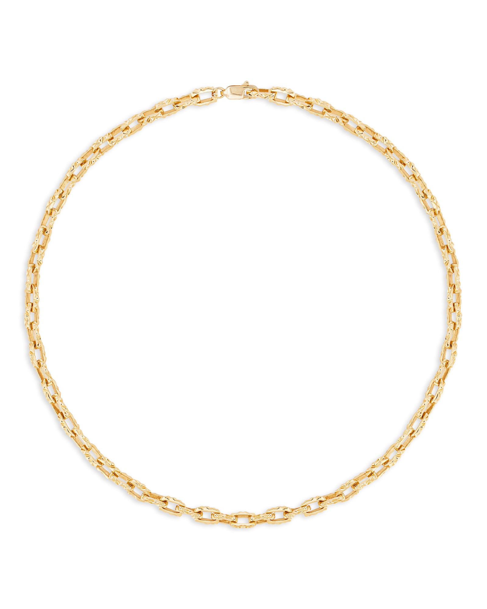 A gold necklace with a reflective surface laid out in a circle on a white background.