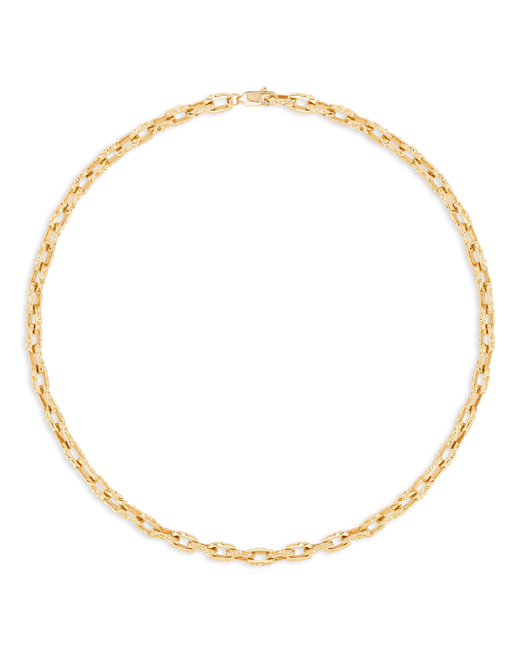 A gold necklace with a reflective surface laid out in a circle on a white background.
