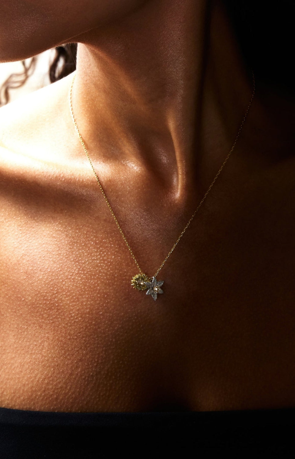 Necklace with a pendant on a person's neck